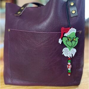 Handcrafted Grinch with beads purse charm.